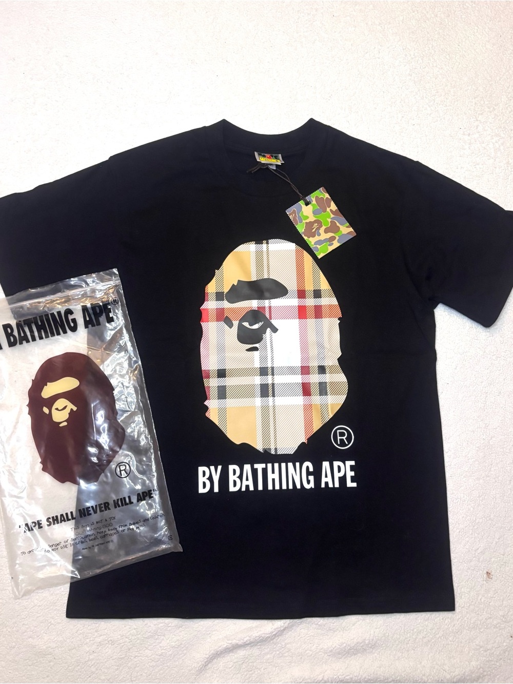 A Bathing Ape Black Tee with Plaid Ape Logo